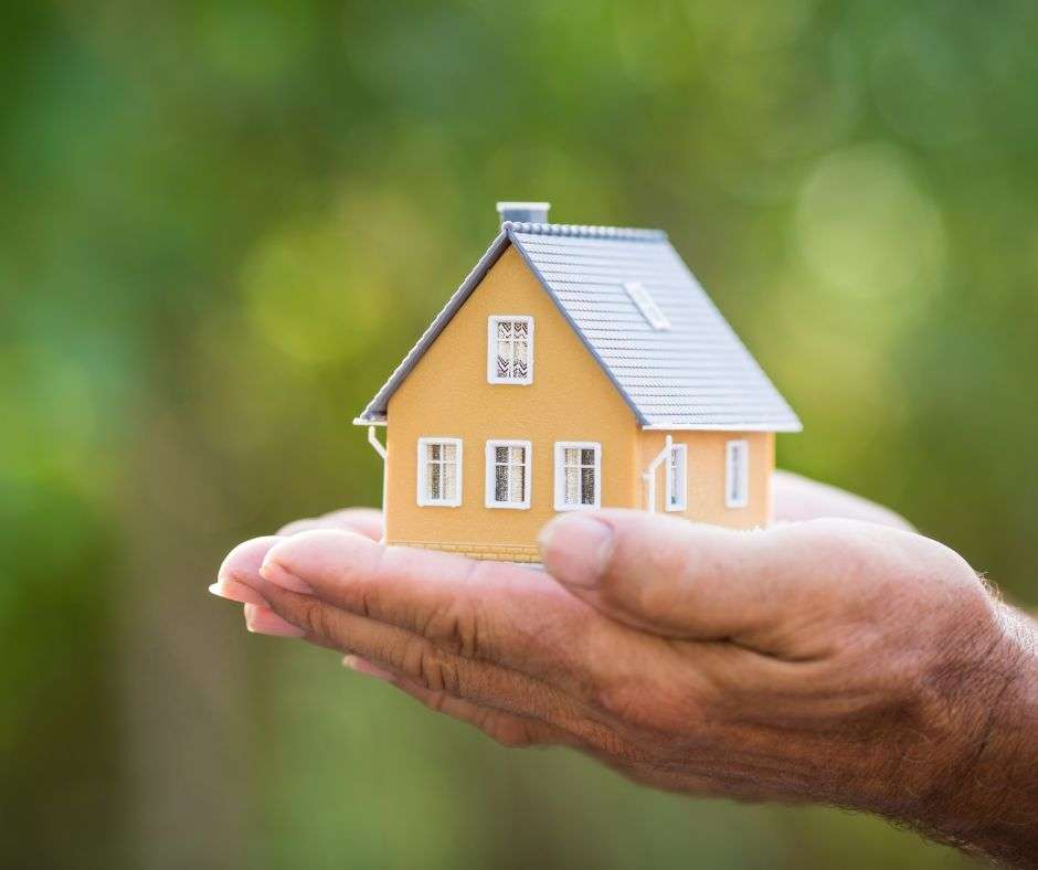 Person holding miniature house - Locksmith in Crawley